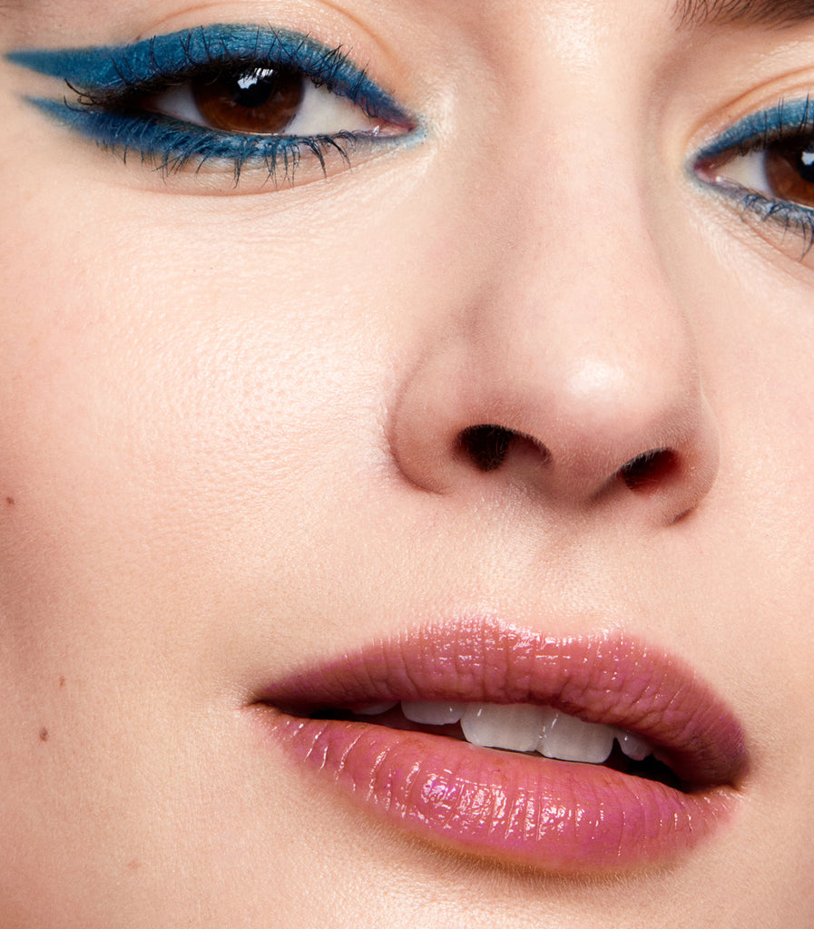 model wearing tinted lip balm in magnetic mauve