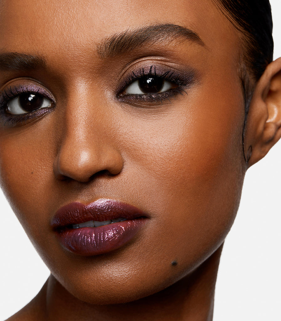 model wearing serum balm intense in purple paradigm