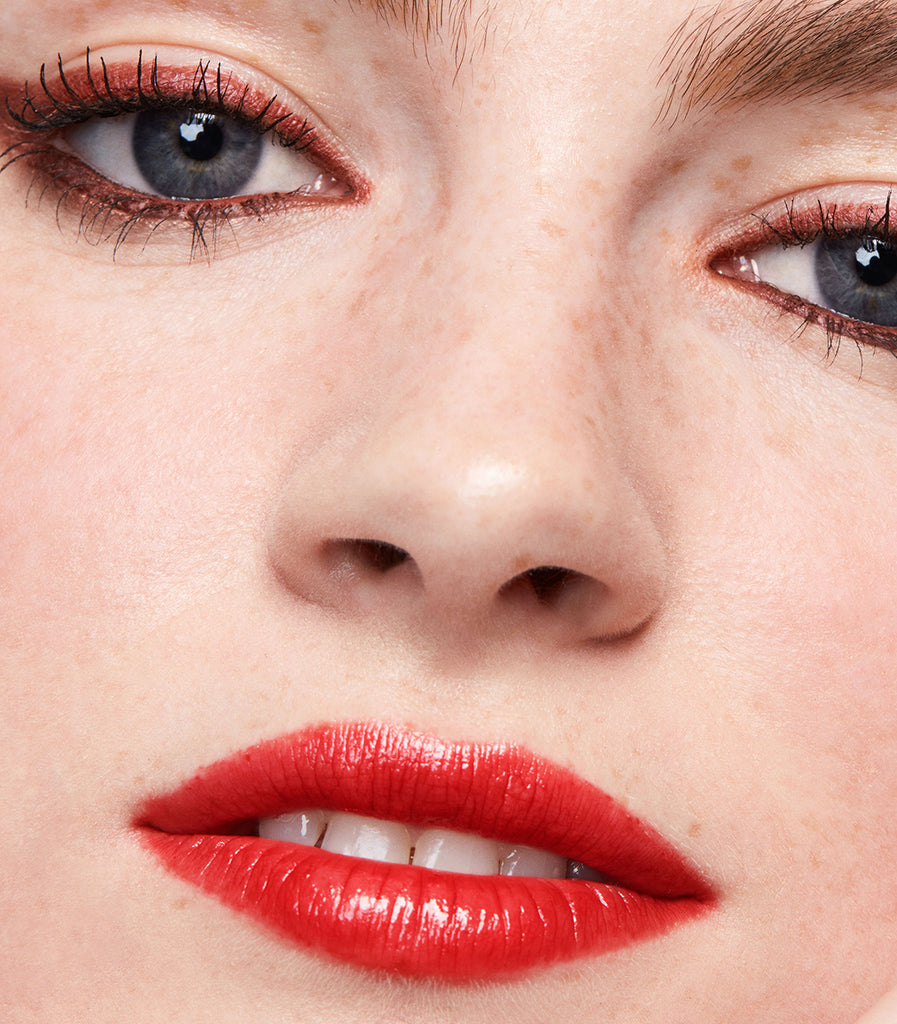 model wearing tinted lip balm in shock layer
